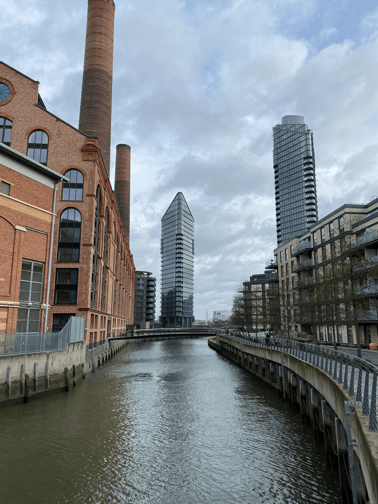 The River Thames in Imperial Wharf surrounded by iconic London buildings.